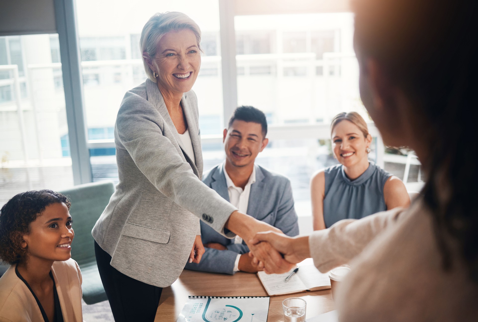 Ceo meeting, success or business people shaking hands after a contract agreement for working together. Diversity, company and happy management welcome a worker in a new partnership deal in office